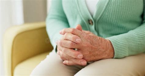 Hands Anxiety And Senior Woman On A Sofa With Stress Fear Or Grief