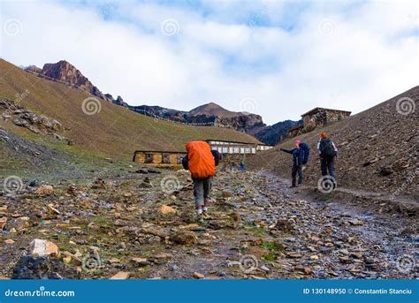 Backpackers On Trekking Path At Thorang La Pass Basecamp Annapurna