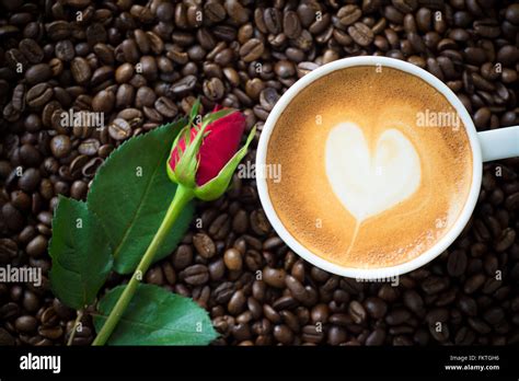 Hot Coffee On Coffee Bean Background Stock Photo Alamy