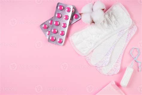 Set Of Feminine Hygiene Products For Menstruation Sanitary Pads Tampons Pills On Pink