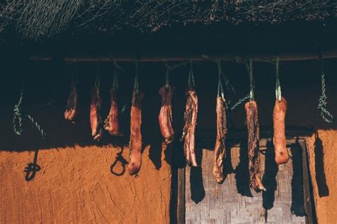 Premium Photo | Meat hanging against wall