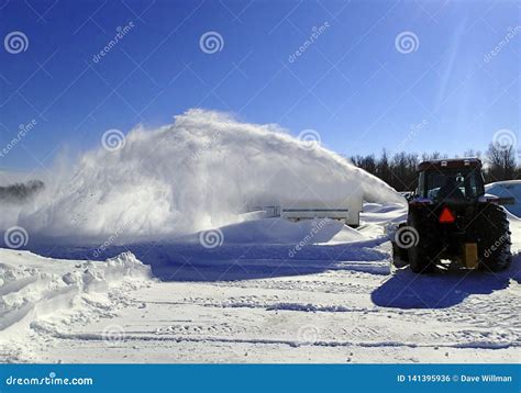 Tractor Blowing Snow after a Storm Stock Photo - Image of banks, cold ...