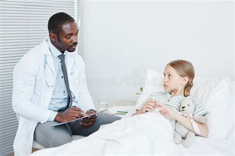 Doctor Talking To Child in Hospital Stock Image - Image of girl ...