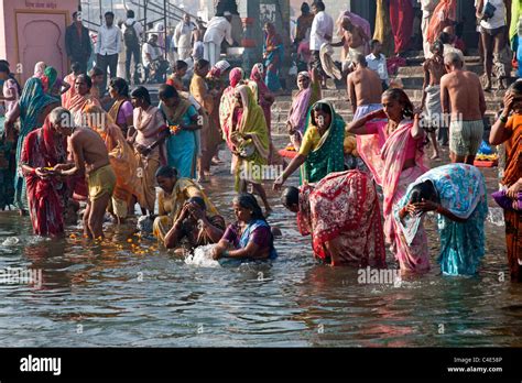 Women Taking The Ritual Bath In The Sacred Waters Of The Godavari River