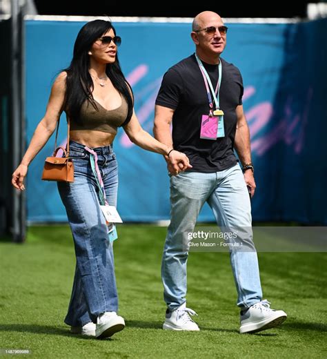 Jeff Bezos and Lauren Sanchez walk in the Paddock prior to final... News Photo - Getty Images