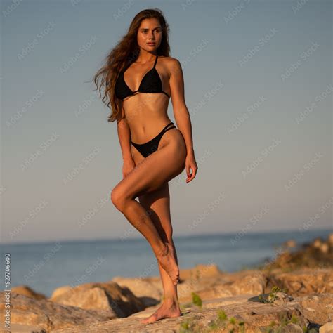 Sexy Fitness Fashion Model Posing In Black Color Mini Bikini On The Rocks Foto De Stock Adobe