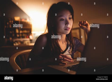 Brunette Using Laptop Stock Photo Alamy