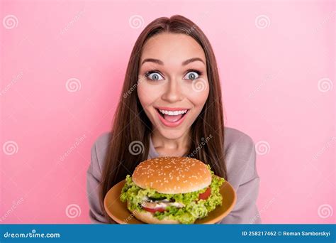 Portrait Of Astonished Cheerful Lady Toothy Smile Hands Hold Burger