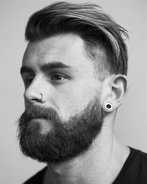 Nathan Mccallum With A Full Beard Nose Piercing And Undercut Style