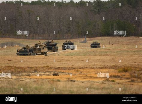 Four M1a1 Abrams Main Battle Tanks And One M88a2 Hercules Recovery