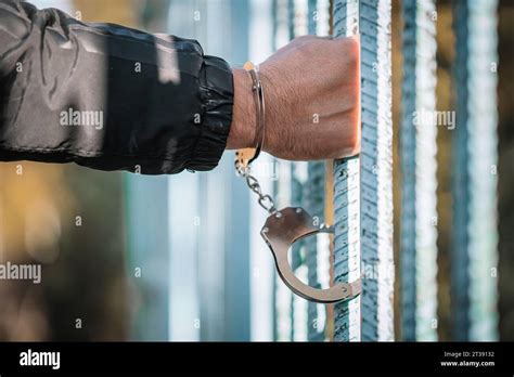 Man Handcuffed In Jail Outdoors Closeup Criminal Law Arrest At The