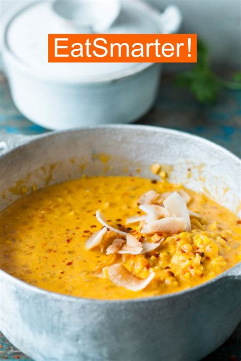 A White Bowl Filled With Soup On Top Of A Table