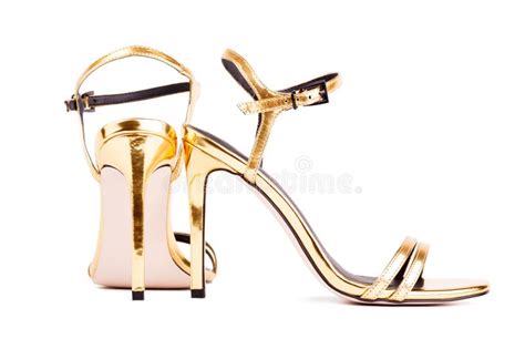Elegant Gold High Heeled Sandals With Sleek Straps For Evening Wear