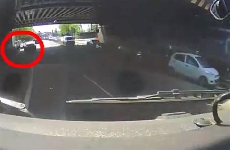 Shocking Moment Driver Swerves Into Cyclist Who Is Thrown From Bike In