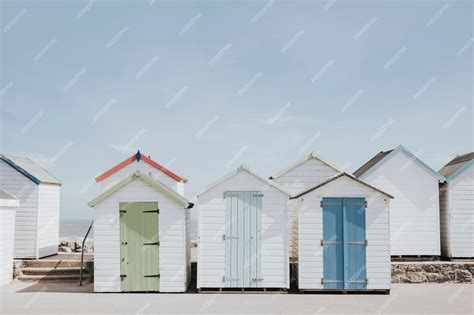 Premium Photo Pastel Beach Huts By The Beach