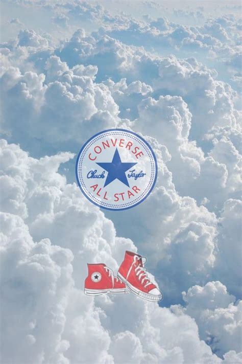 Two Pairs Of Converse High Top Sneakers Floating In The Sky Above