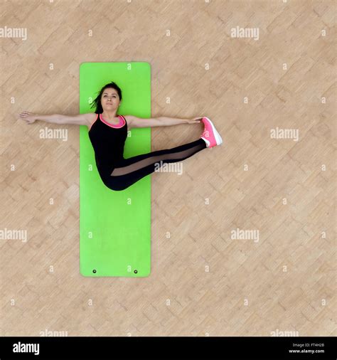 Fitness Woman Doing Stretching Exercises On Mat Above Image With Copy