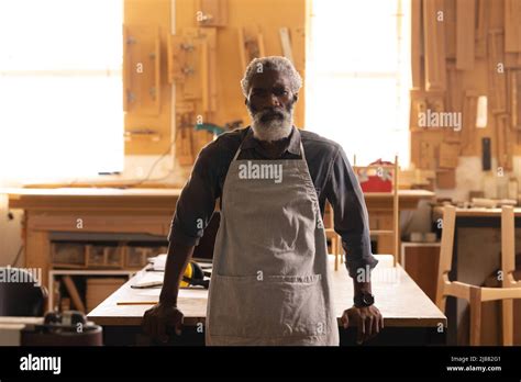 Portrait Of Confident African American Mature Carpenter Standing In