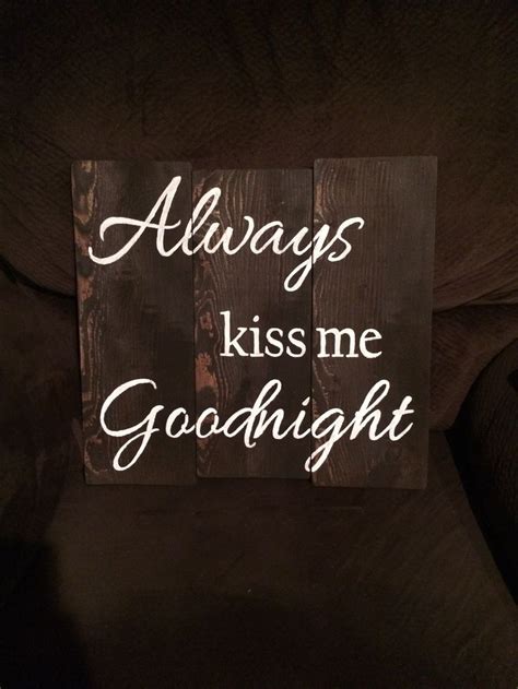 A Wooden Sign That Says Always Kiss Me Goodnight