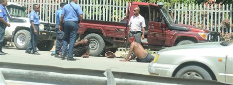 LatestNews_02_The-two-men-being-apprehended-by-policemen-infront-of ...