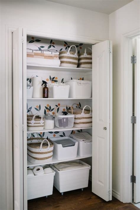 Pretty Functional Small Linen Closet Makeover