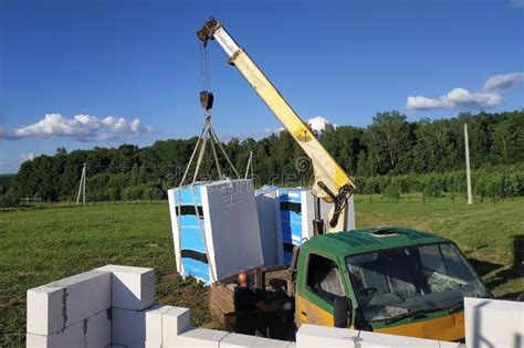 The Process Of Loading And Unloading Using A Mobile Crane Blocks And