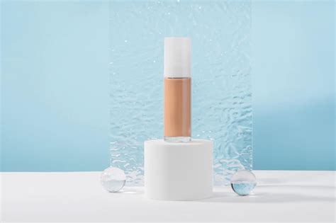 Premium Photo Cosmetic Liquid Foundation Nude Cream Bottle Mockup On White Cylinder Block