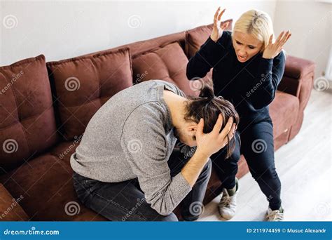 Tired Frustrated Caucasian Husband Ignoring Angry Despot Wife Arguing