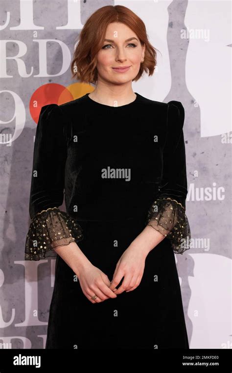 Alice Levine Poses For Photographers Upon Arrival At The Brit Awards In