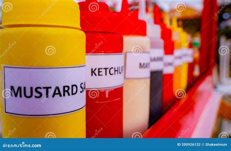 Multiple Flavor Sauce Bottles In A Food Card At A Food Festival