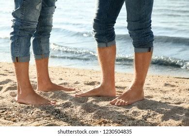 Gay Couple Standing Barefoot On Beach ภาพสตอก Shutterstock