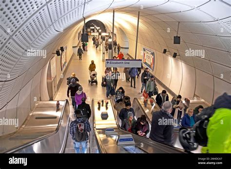 People Commuters Tourists Travellers Riding On An Escalator In New