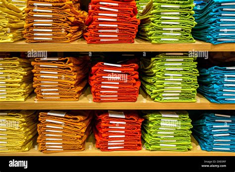 Neat Stacks Of Folded Clothing On The Shop Shelves Stock Photo Alamy