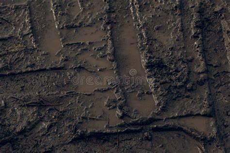 Dark Muddy Road Background With Tire Traces Dirty Ground Stock Image