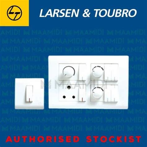 A White Plastic Larsen Toubro Plate Switches At Piece In