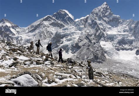 A Group Of Trekkers On The Summit Of Kala Pattar The High Point Of The