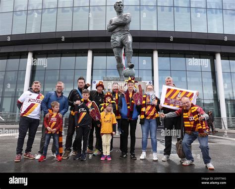 Bradford City fans pose outside Wembley Stadum ahead of the match Stock Photo - Alamy