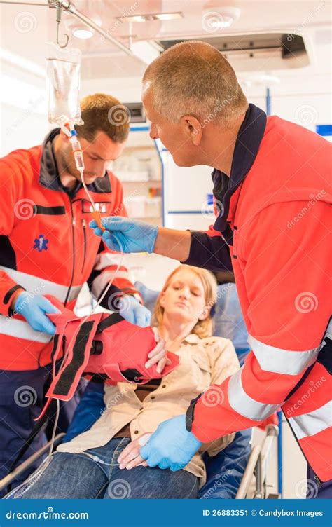 Paramedics In Ambulance With Patient Broken Arm Stock Image Image Of