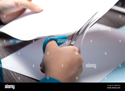 Teenager S Hands Are Cutting Paper With Scissors Making Origami Stock