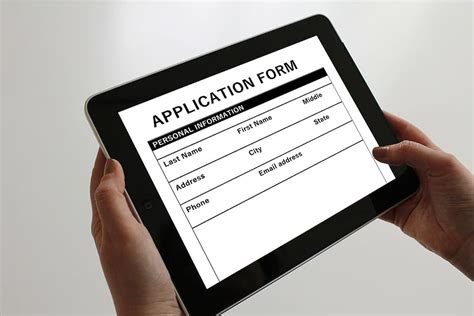 person holding tablet displaying application form tablet computer