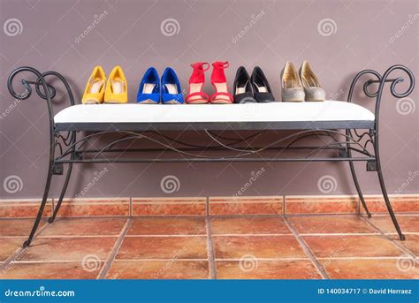 Collection Of Woman High Heel Shoes On White Sofa Stock Image