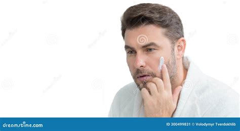 Man With Cosmetic Cream Male Spa Model Applying Skin Care Cream