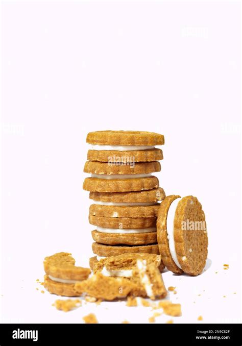 Stack Of Sandwich Cookies With Cream On White Background Stock Photo