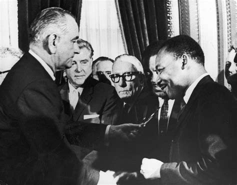 Us President Lyndon B Johnson Hands A Pen To Civil Rights Leader Dr