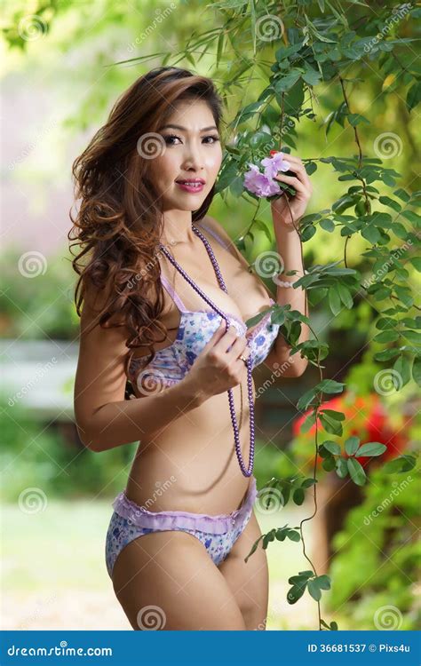 Beautiful Asian Woman In Lingerie Voluptuous Posing Outdoors Stock