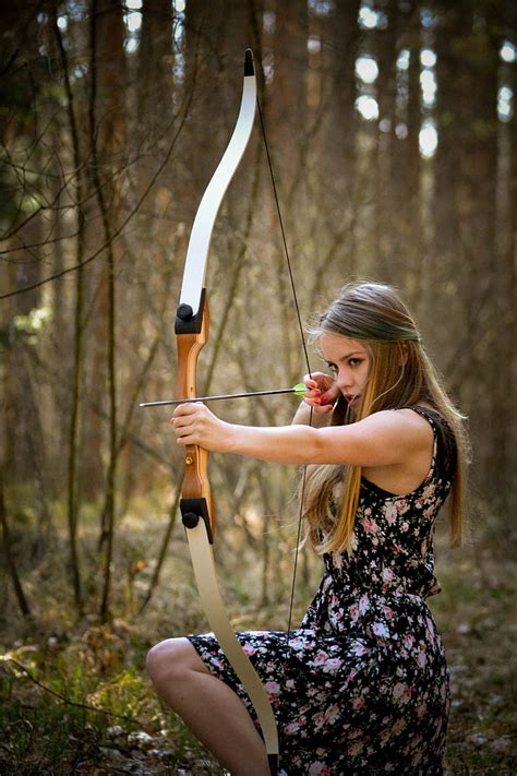 Royalty Free Photo Woman In Black Floral Dress Holding Bow And Arrow