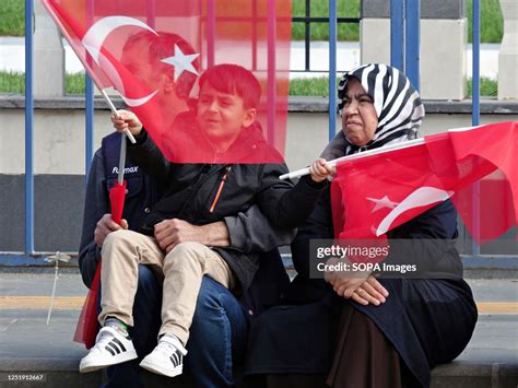 A family attends Turkish President Recep Tayyip Erdogan's campaign ...