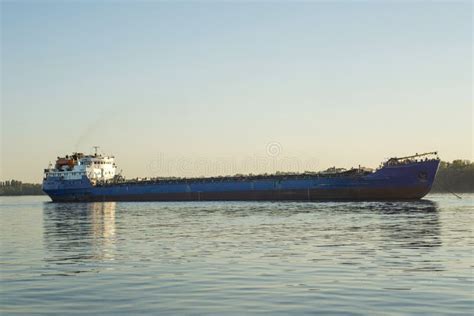 Large Cargo Ship Sailing In Still Water Cargo Ship On The River Stock