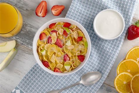 Healthy Breakfast Cornflakes And Strawberries With Milk Yogurt And