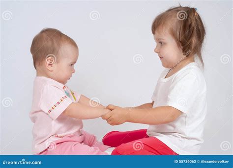 Two Little Sisters Are Holding Hands Stock Image Image Of Friendship